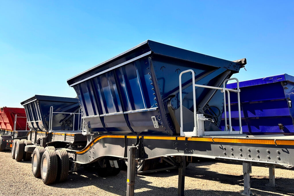 34 ton side tipper trailers parked in a gravel yard